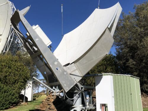 3.8m batwing satellite dish with a green shed next to it